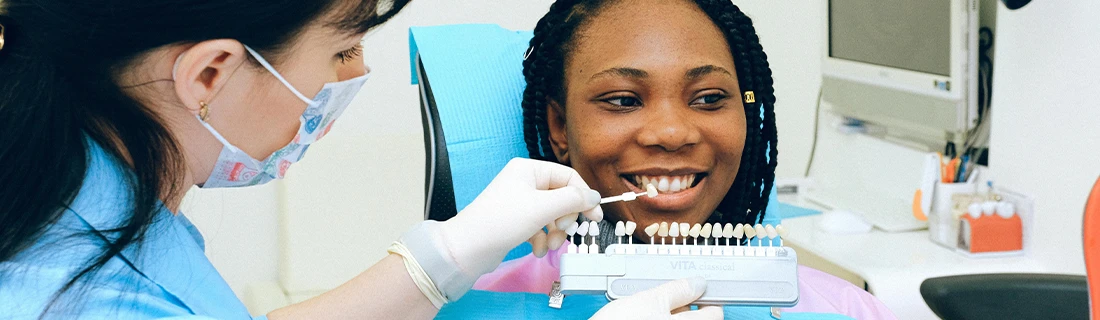 Woman In Dental Chair Being Fitted For Veneers